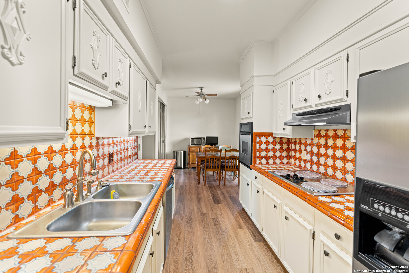 3678 Hidden Drive, Unit 1301 San Antonio, TX 78217 - Photo 12 of 47 a kitchen with granite countertop a sink stove and refrigerator