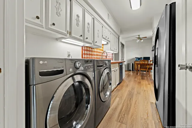 a view of a kitchen with washer and dryer