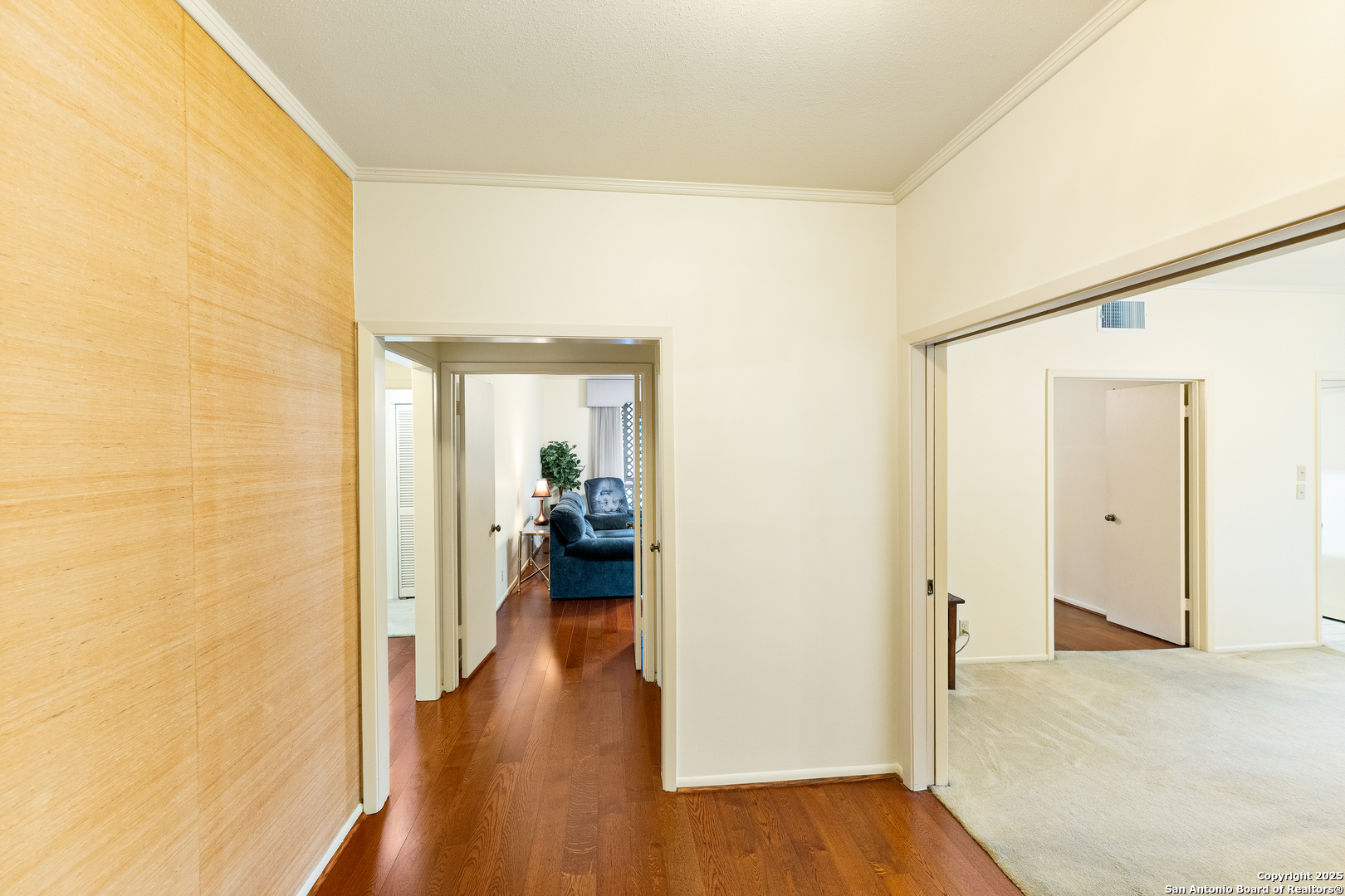 3678 Hidden Drive, Unit 1301 San Antonio, TX 78217 - Photo 30 of 47 a view of a hallway with a wooden floor