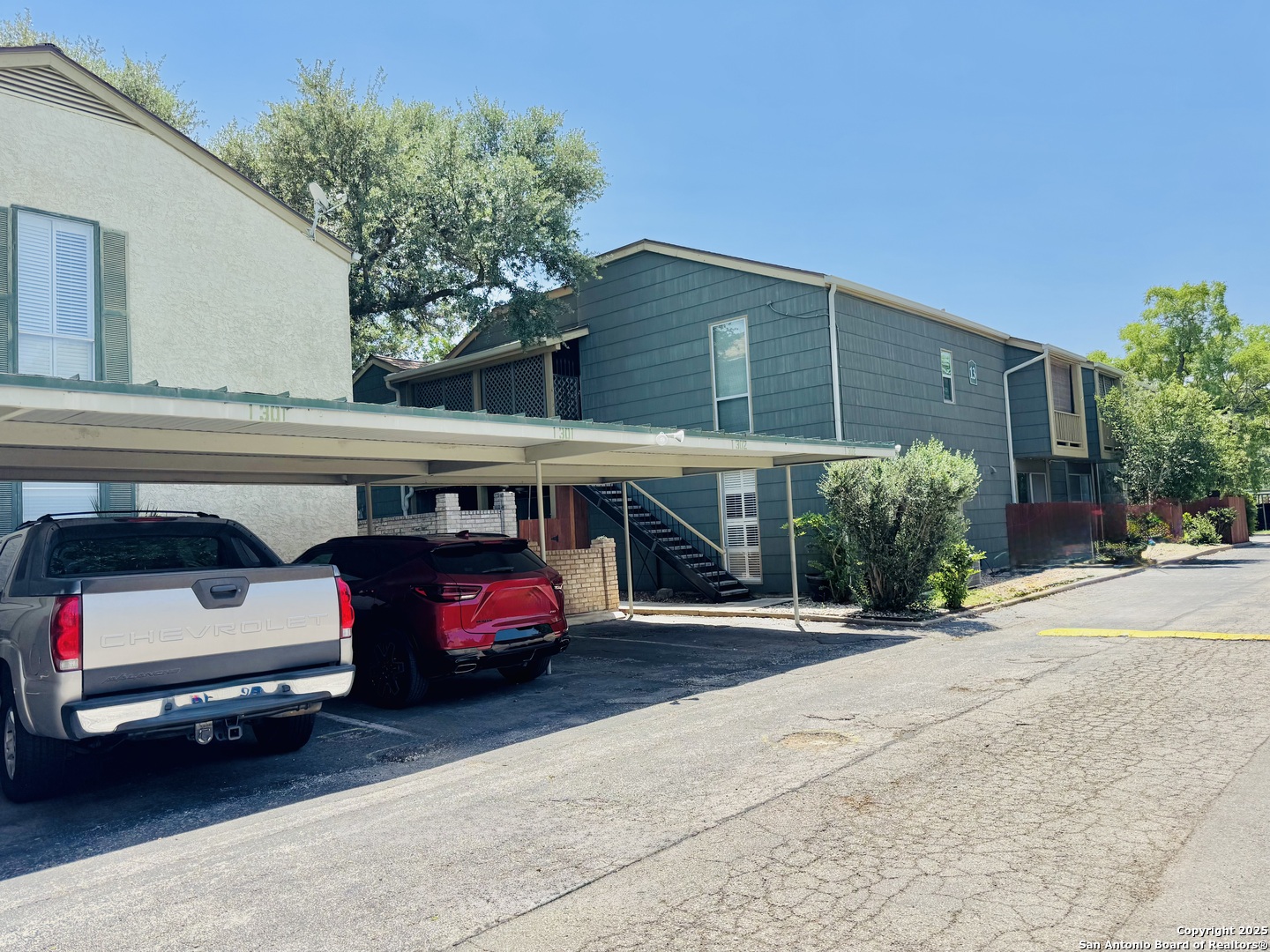 3678 Hidden Drive, Unit 1301 San Antonio, TX 78217 - Photo 45 of 47 a view of car parked in front of garage