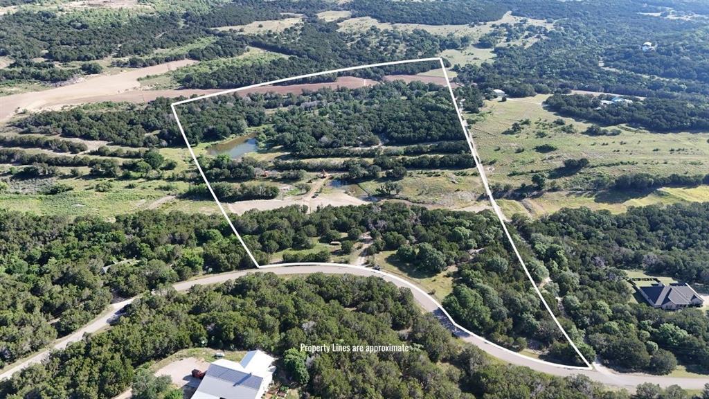 2801 Wind Point Court Tolar, TX 76476 - Photo 3 of 25 a view of a forest with a park