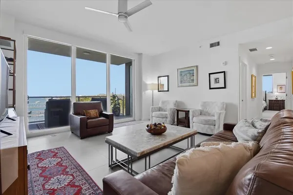a living room with furniture plant and a potted plant
