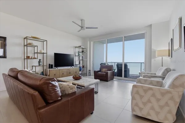 a spacious bedroom with a bed and a couch