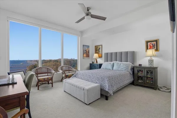 a bedroom with a bed and a couch