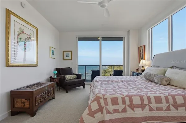 a bedroom with a bed and a couch