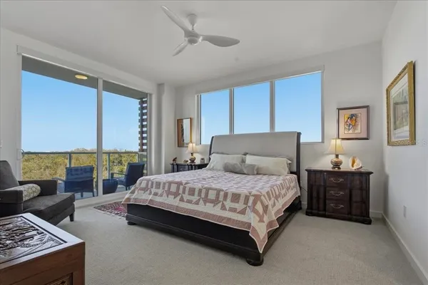 a bedroom with two beds and a couch