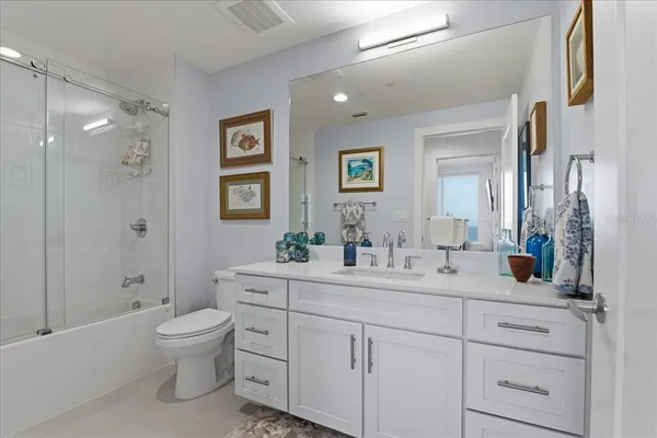 a bathroom with a toilet a sink and a shower