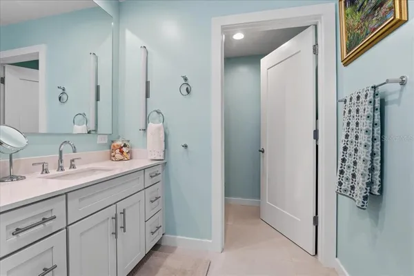 a view of a room with a chairs and a floor to ceiling window