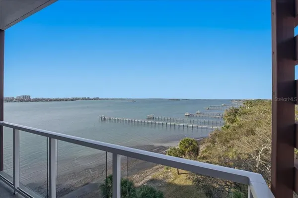 a living room with furniture a rug and a flat screen tv