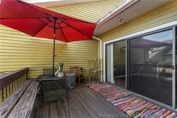 a balcony view with a seating space