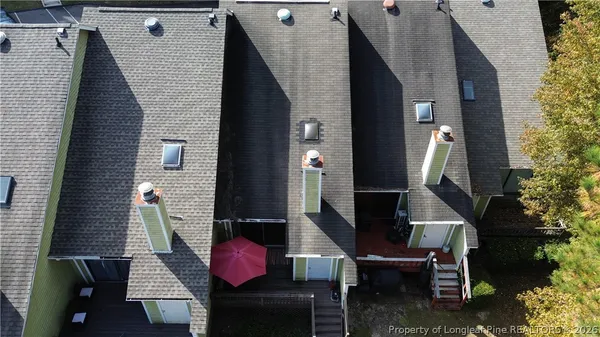 a front view of a house with outdoor seating
