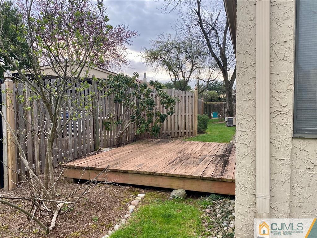 2 Park Gate Drive Edison, NJ 08820 - Photo 4 of 13 a view of backyard with wooden fence