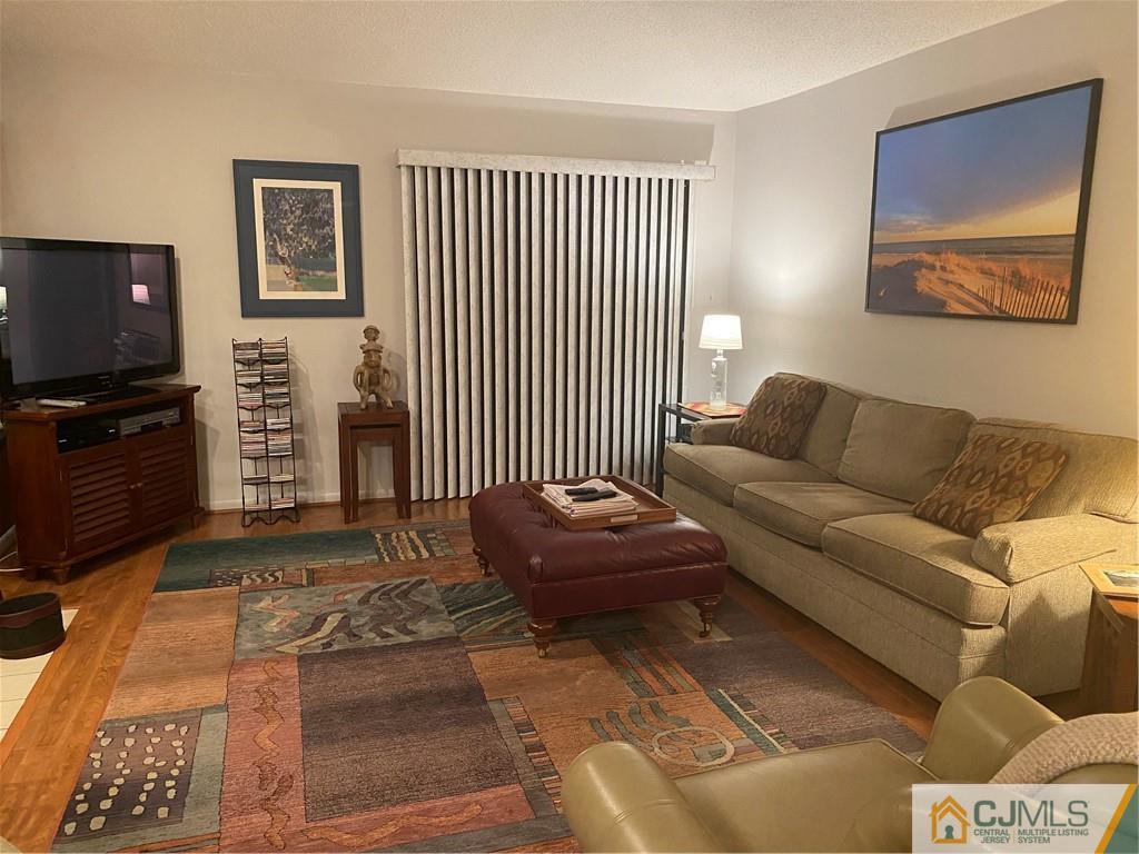 2 Park Gate Drive Edison, NJ 08820 - Photo 7 of 13 a living room with furniture and a flat screen tv
