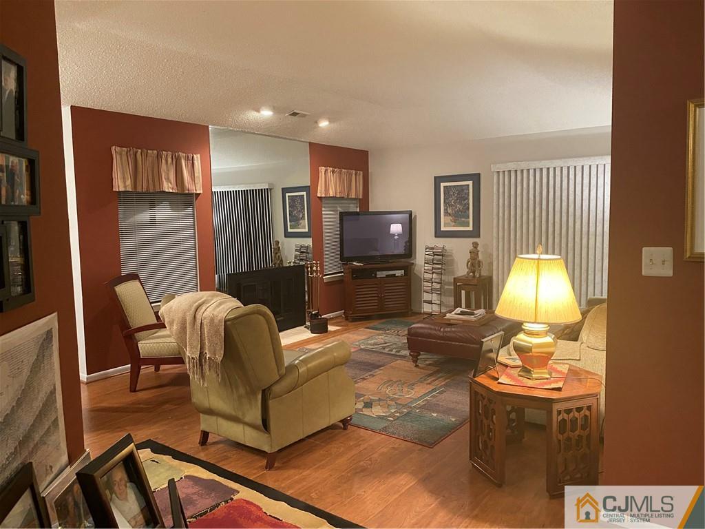 2 Park Gate Drive Edison, NJ 08820 - Photo 8 of 13 a living room with furniture and a fireplace