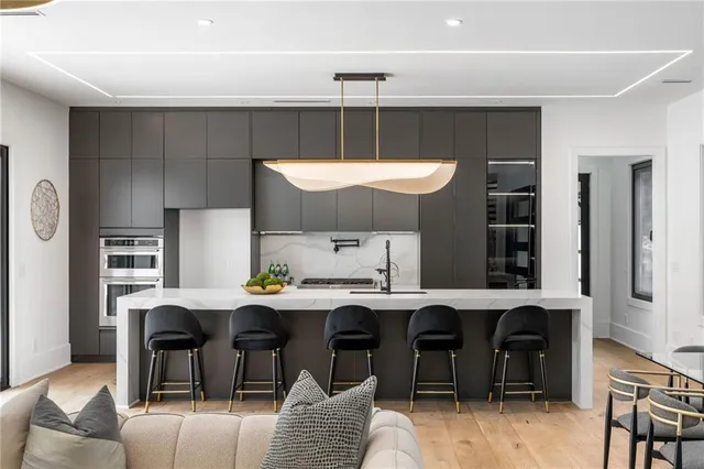 a kitchen with a table chairs and a refrigerator