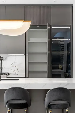 a kitchen with a sink and a stove