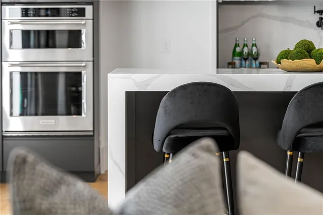 a living room with furniture and potted plant