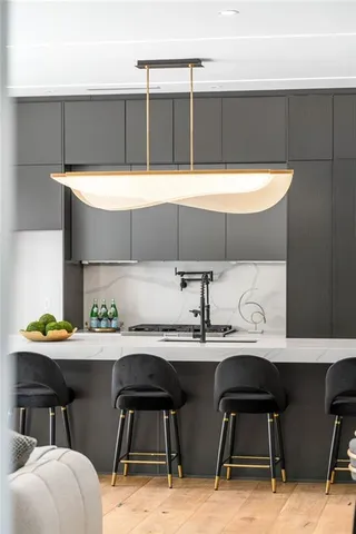 a kitchen with a table chairs and a stove