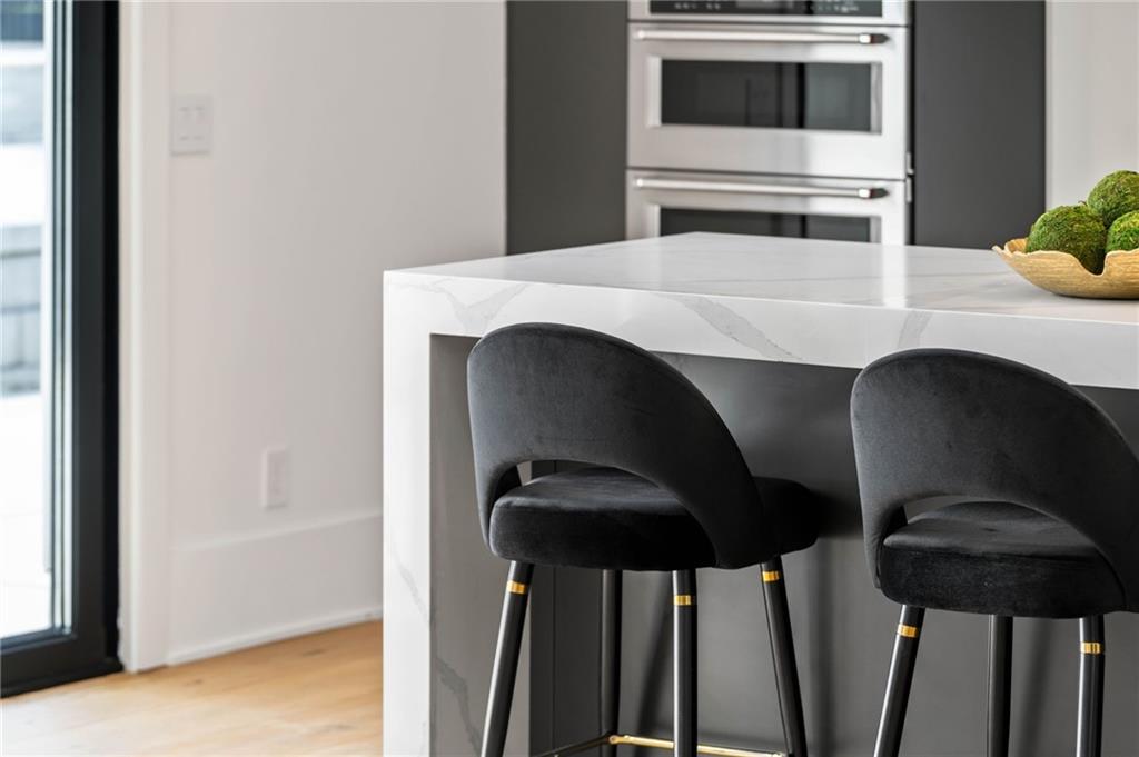 605 Hunnicutt Road Southeast Mableton, GA 30126 - Photo 16 of 35 a kitchen with a table and chairs
