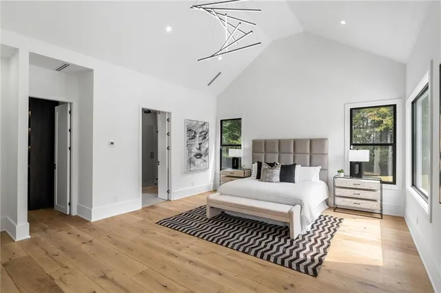 a bedroom with a large bed and a couch