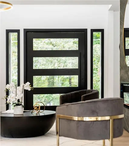 a view of a living room and a floor to ceiling window