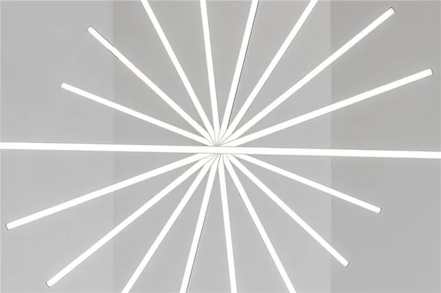 a large bedroom with a bed and wooden floor