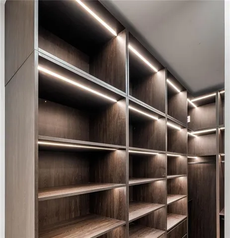 a en suite bathroom with a sink double vanity and a mirror