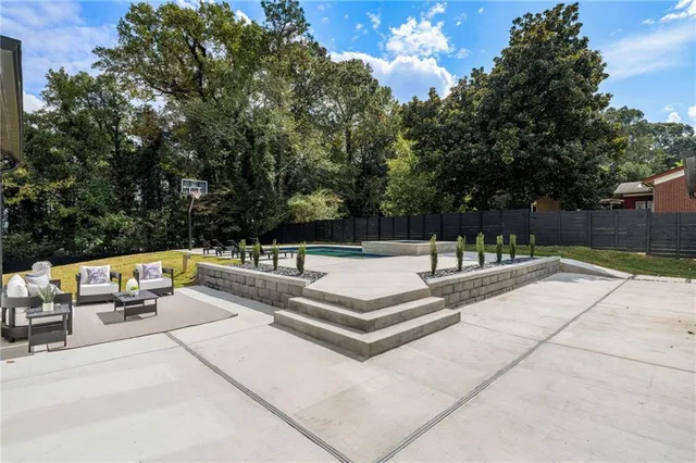 a aerial view of a house with swimming pool and sitting area