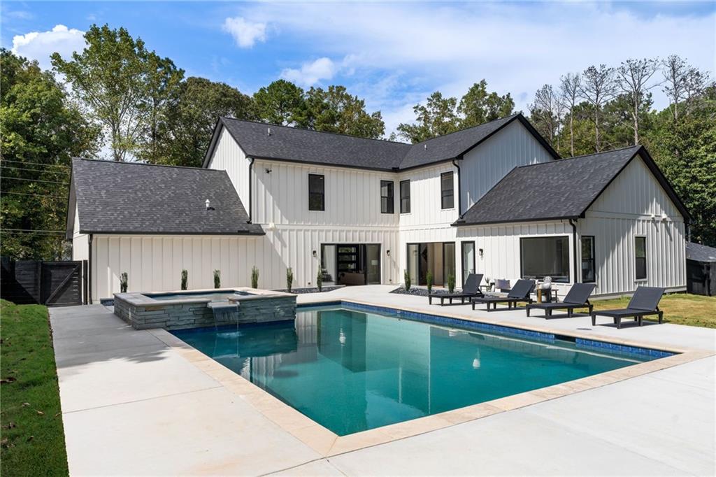 605 Hunnicutt Road Southeast Mableton, GA 30126 - Photo 34 of 35 a aerial view of a house with swimming pool and sitting area
