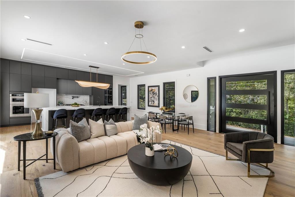 605 Hunnicutt Road Southeast Mableton, GA 30126 - Photo 4 of 35 a living room with furniture a rug and a large window