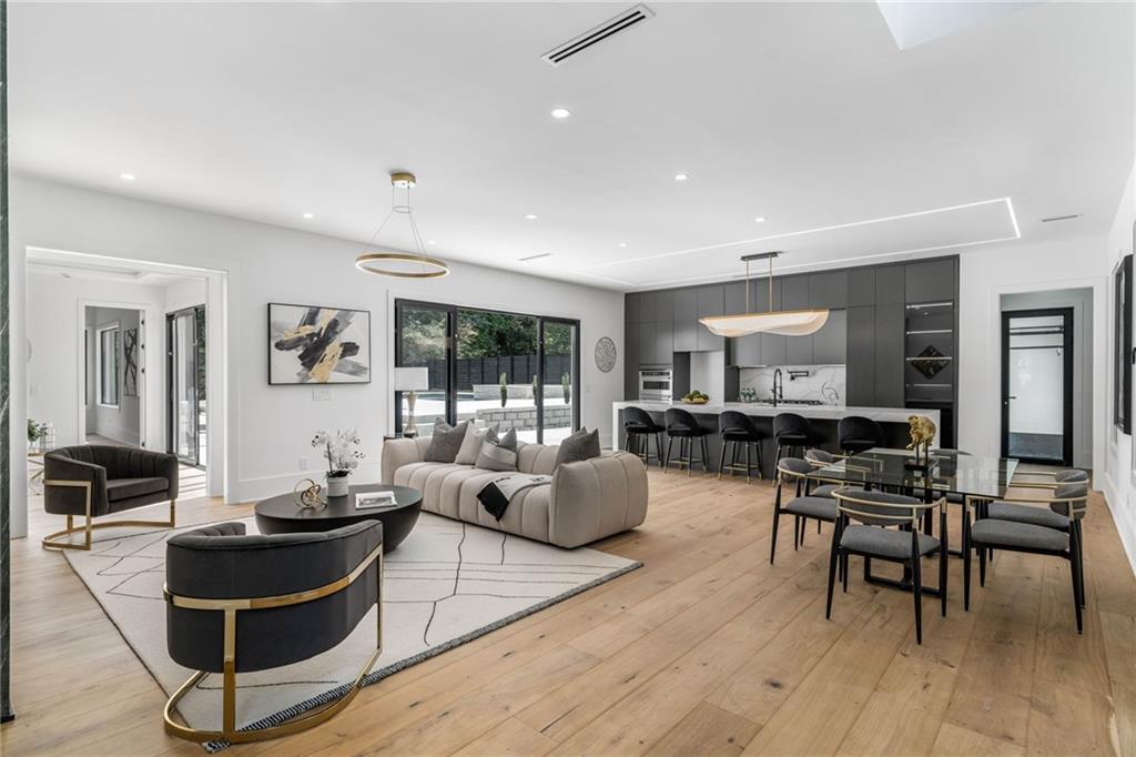 605 Hunnicutt Road Southeast Mableton, GA 30126 - Photo 5 of 35 a living room with furniture and a wooden floor