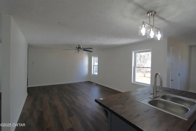 a kitchen with sink and window