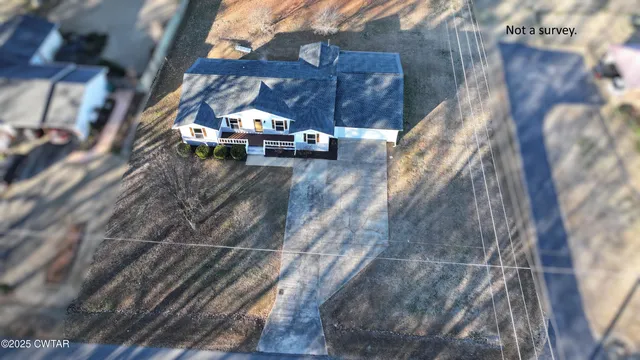 a view of houses with a street