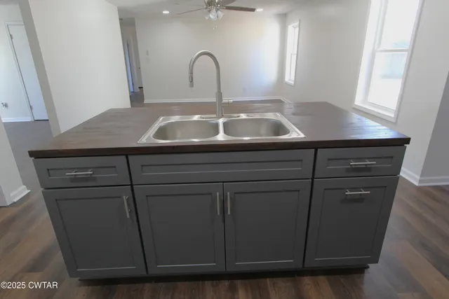 a close view of a sink a vanity and window in a room