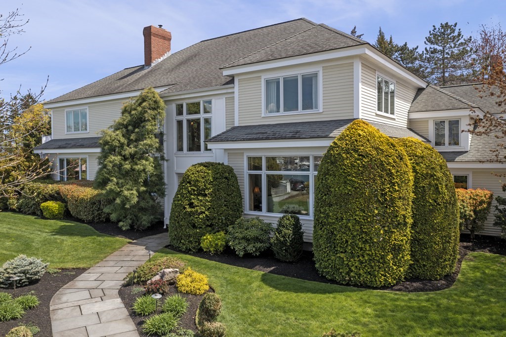a front view of a house with garden
