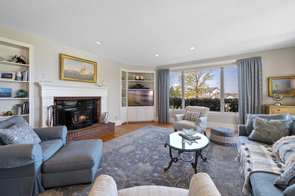 25 Foster Street Marblehead, MA 01945 - Photo 17 of 42 a living room with furniture and a fireplace