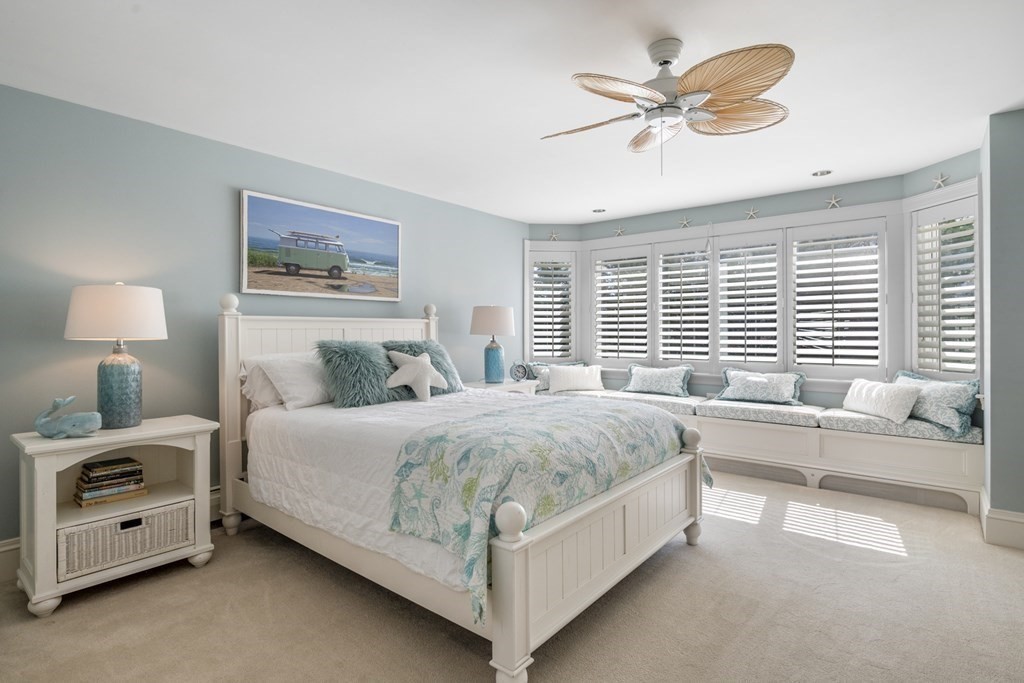 25 Foster Street Marblehead, MA 01945 - Photo 24 of 42 a spacious bedroom with a bed and a large window