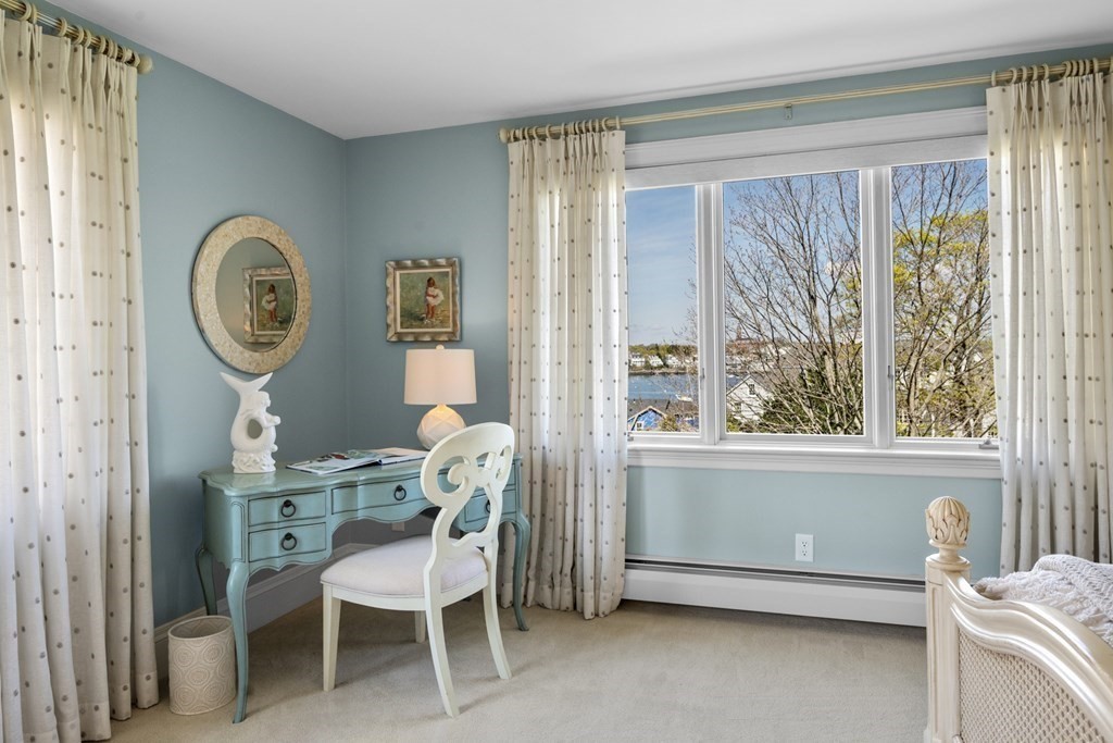 25 Foster Street Marblehead, MA 01945 - Photo 27 of 42 a room with a window and a chair
