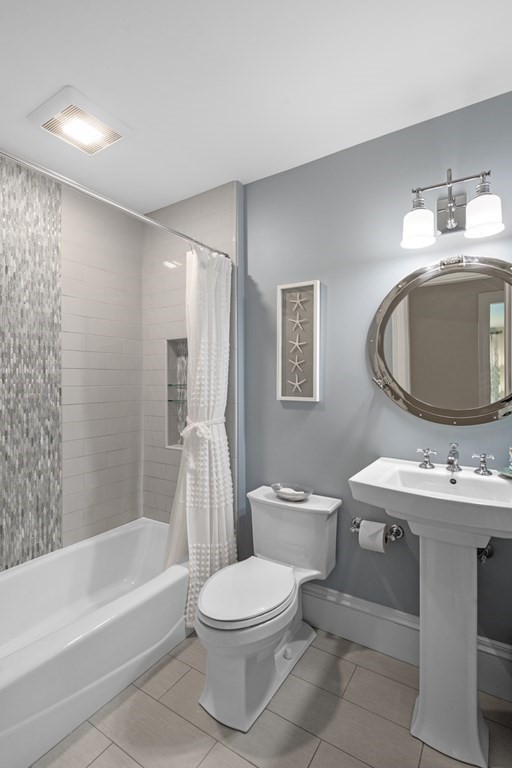 25 Foster Street Marblehead, MA 01945 - Photo 31 of 42 a bathroom with a sink toilet and shower