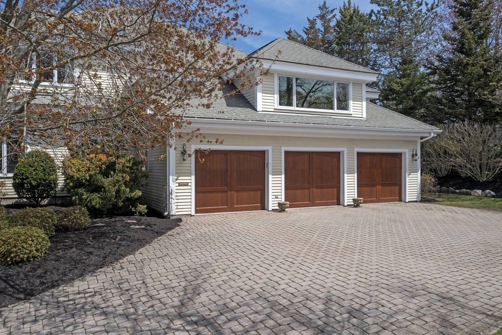 25 Foster Street Marblehead, MA 01945 - Photo 7 of 42 a front view of a house with a yard and garage