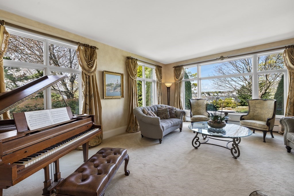 25 Foster Street Marblehead, MA 01945 - Photo 10 of 42 a living room with furniture and a window