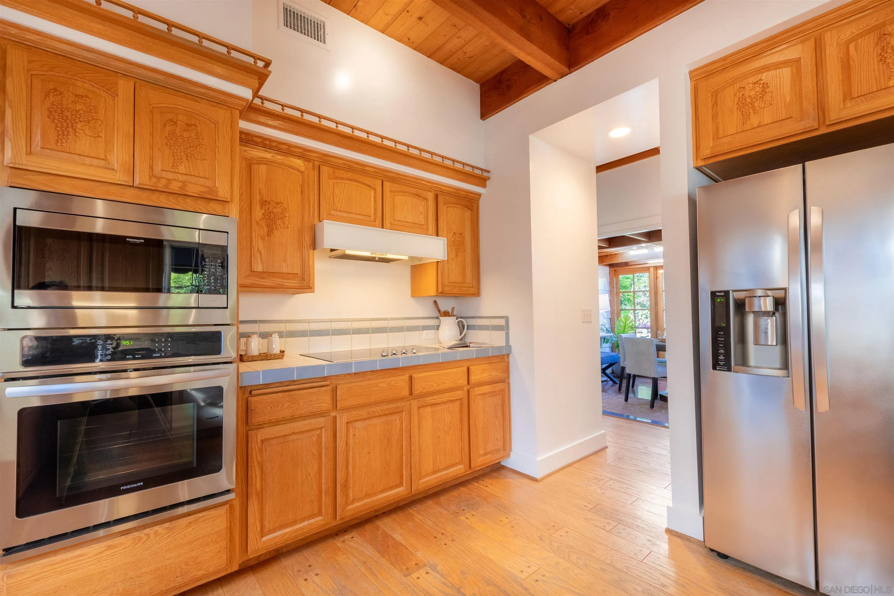 1041 Temple Terrace Laguna Beach, CA 92651 - Photo 12 of 43 a kitchen with stainless steel appliances granite countertop a refrigerator and a stove top oven