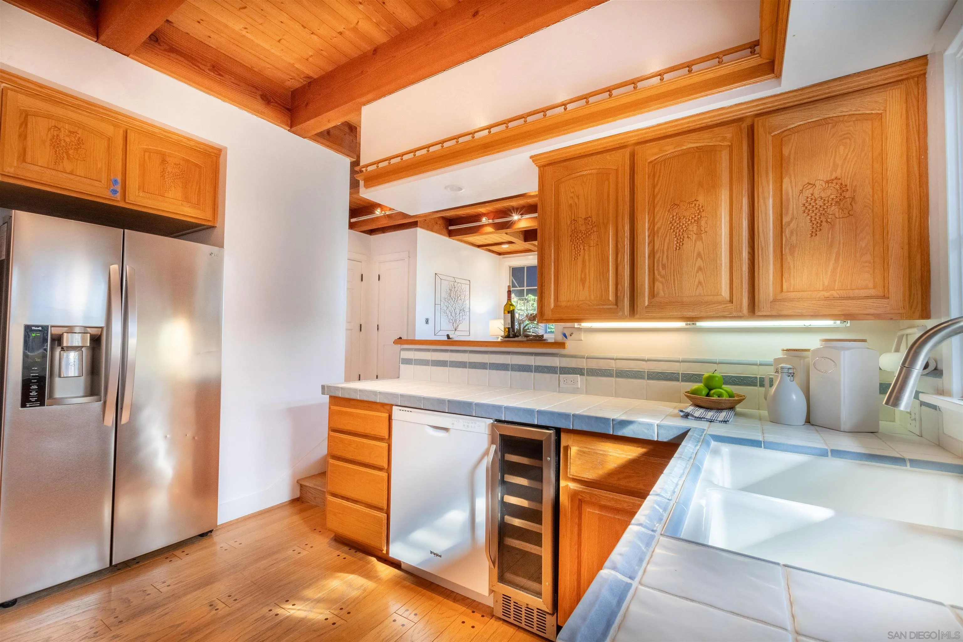 1041 Temple Terrace Laguna Beach, CA 92651 - Photo 14 of 43 a kitchen with stainless steel appliances granite countertop a refrigerator and a sink