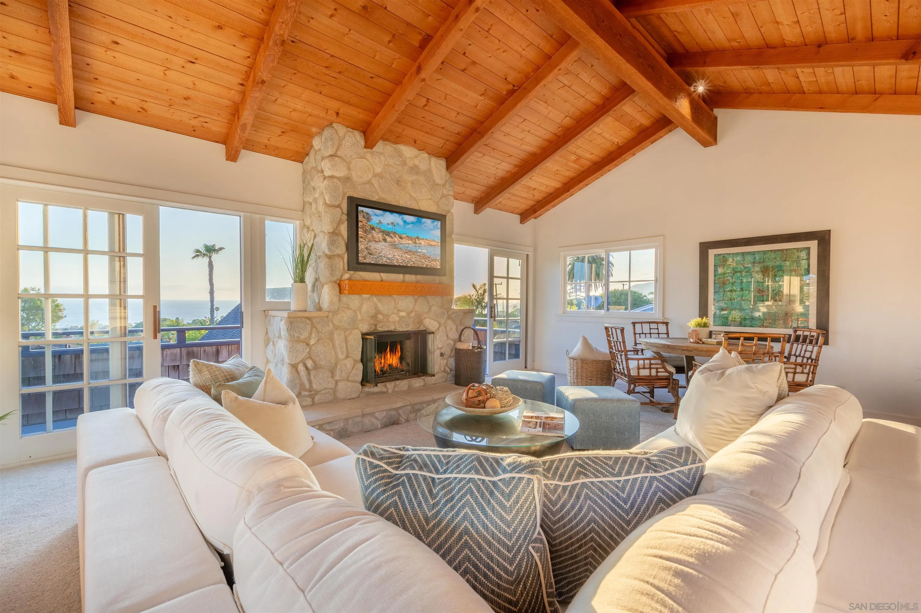 1041 Temple Terrace Laguna Beach, CA 92651 - Photo 16 of 43 a living room with furniture a fireplace and a floor to ceiling window