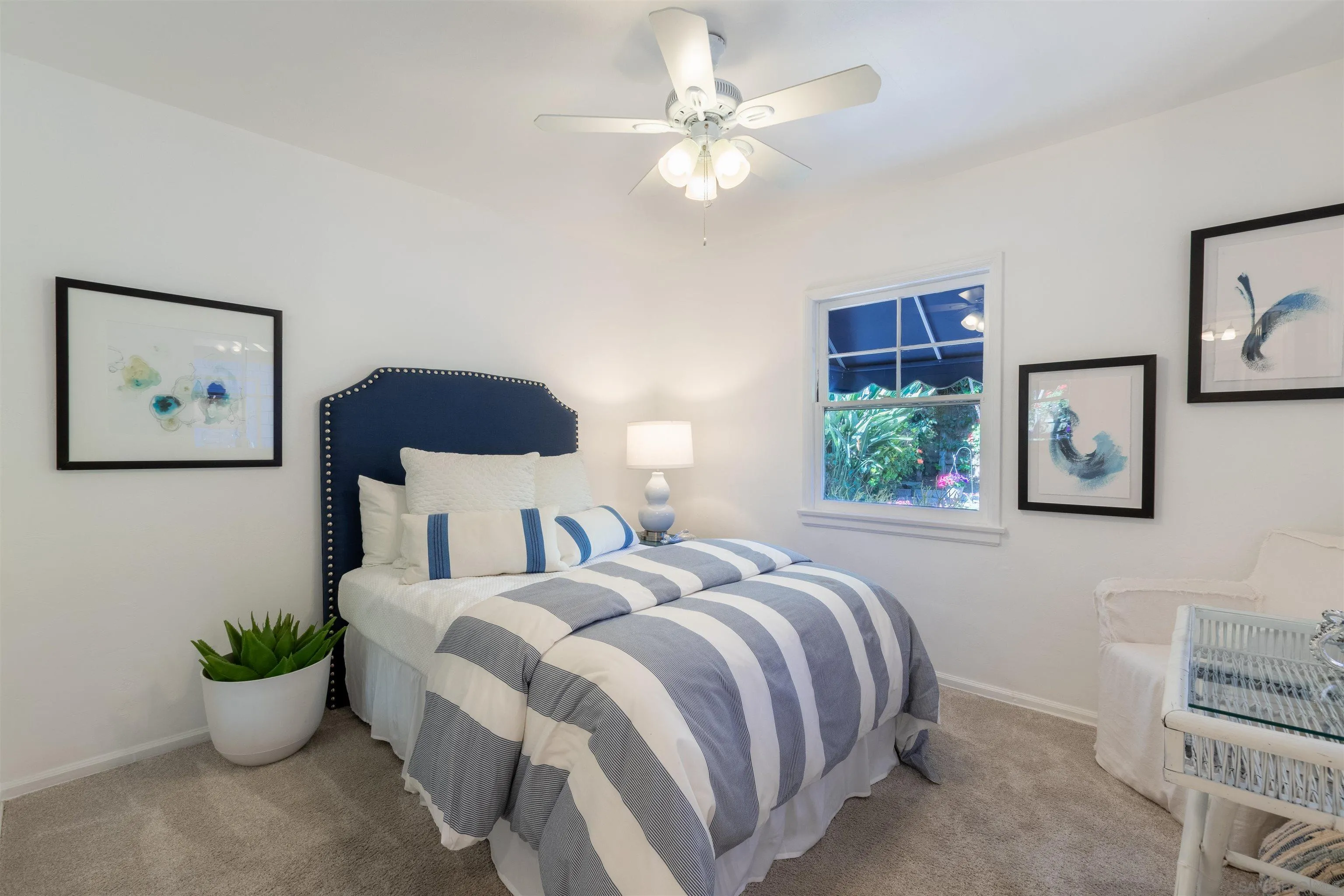 1041 Temple Terrace Laguna Beach, CA 92651 - Photo 23 of 43 a bedroom with a large bed and a chandelier