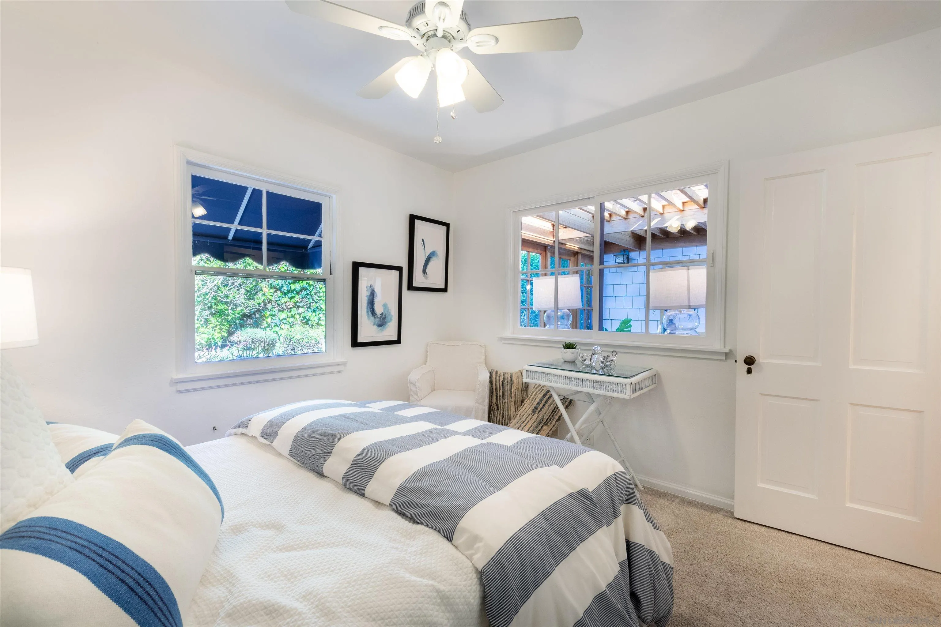 1041 Temple Terrace Laguna Beach, CA 92651 - Photo 24 of 43 a bedroom with a bed and a chandelier