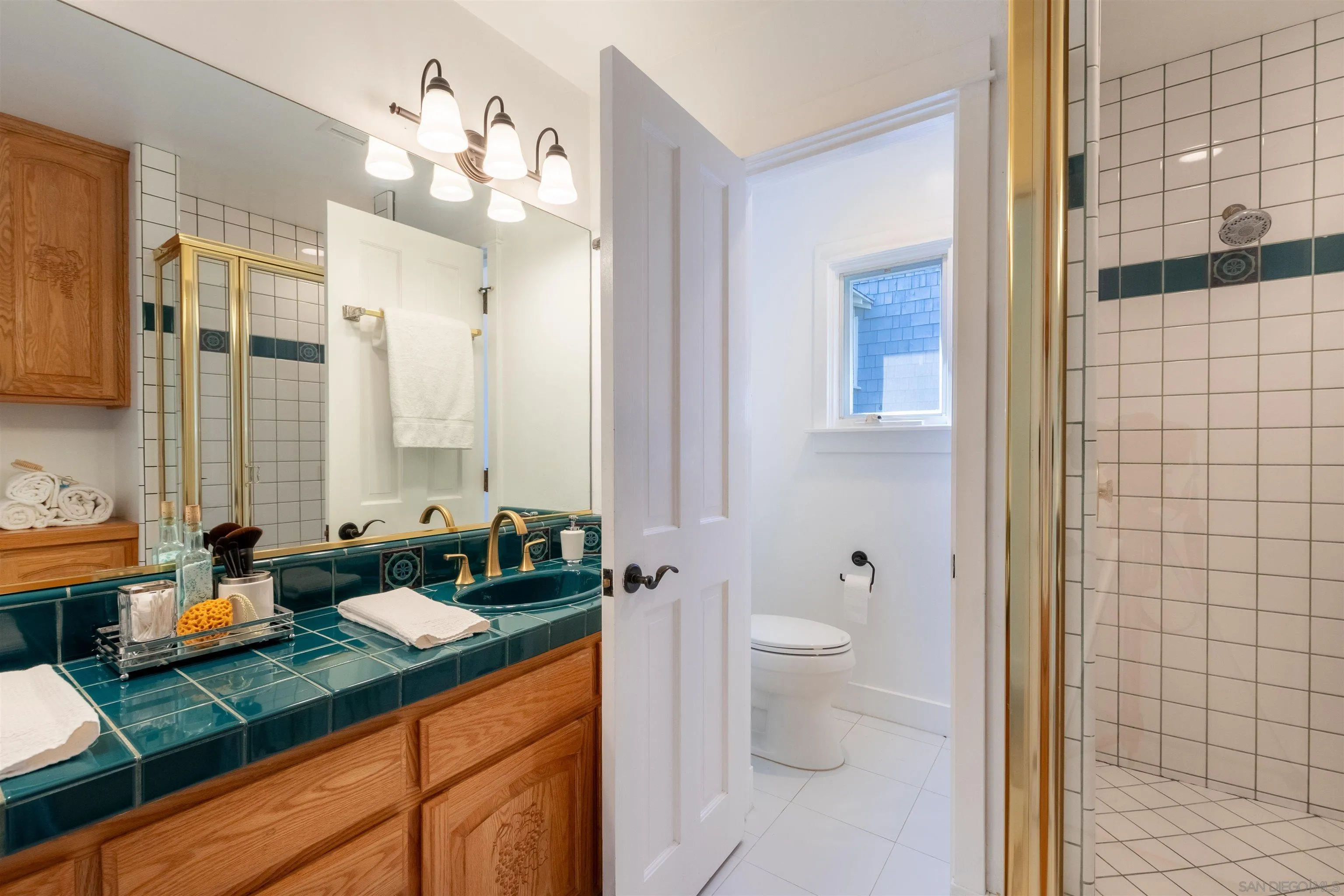 1041 Temple Terrace Laguna Beach, CA 92651 - Photo 25 of 43 a bathroom with a double vanity sink toilet and shower