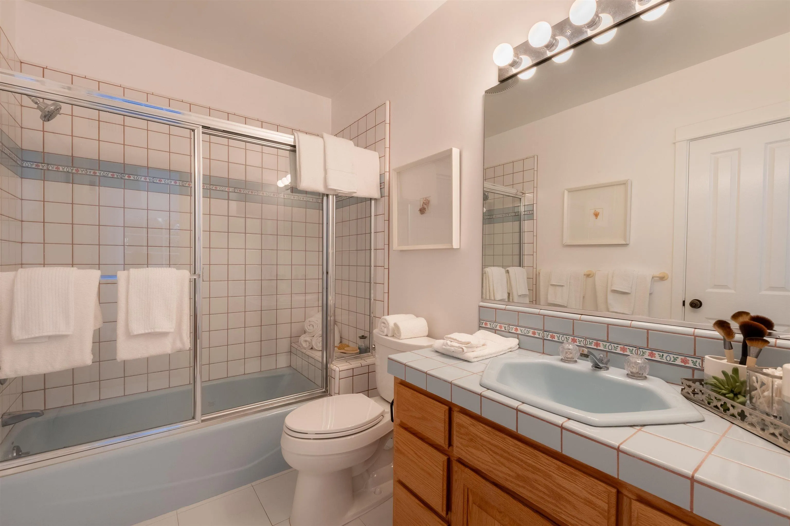 1041 Temple Terrace Laguna Beach, CA 92651 - Photo 30 of 43 a bathroom with a sink a toilet and shower