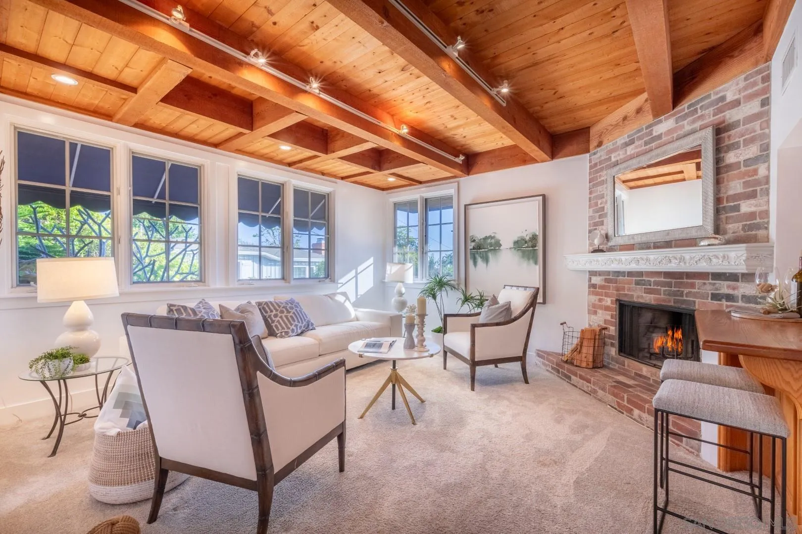 1041 Temple Terrace Laguna Beach, CA 92651 - Photo 9 of 43 a living room with furniture a fireplace and a table