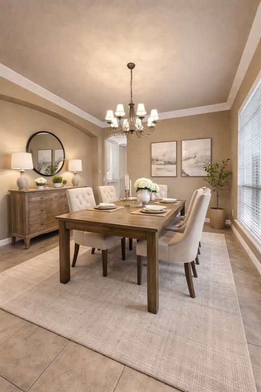 282 Heather Lane Decatur, TX 76234 - Photo 7 of 35 a dining room with wooden floor a chandelier a wooden table and chairs